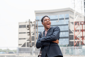 young african businessman outdoor looking amazed