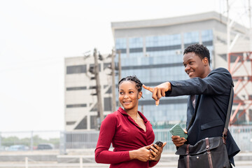 african man giving a lady directions