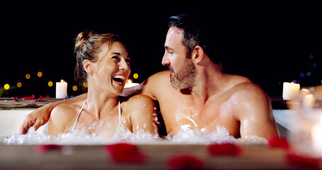 Spa, love and couple in a jacuzzi happy, smile and relax one date night at a wellness resort. Zen, hot tub and man with woman laughing, peace and enjoying a romantic vacation, holiday or anniversary - obrazy, fototapety, plakaty