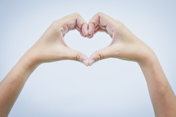 Empty hand making heart shape isolated on white background