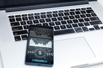 smartphone with IPO graphics. app is open on smart phone - Stock chart is visible in the background. online marketplace for freelance digital services.