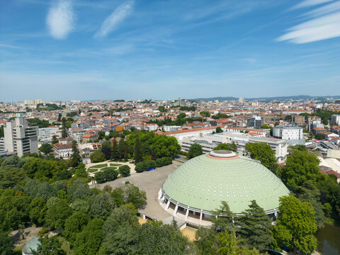aerial photography of the Palace Garden Tower in Porto, Lisbon. In the image you can see the superbook arena, a park full of trees and the beautiful gardens