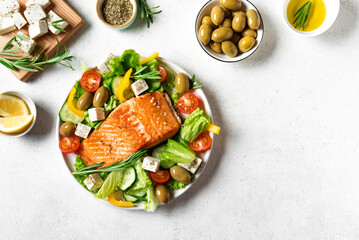 Grilled salmon fish fillet and greek salad