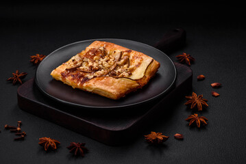 Delicious fresh sweet pie or pizza with pear, brie cheese, honey and nuts