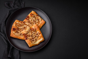 Delicious fresh sweet pie or pizza with pear, brie cheese, honey and nuts