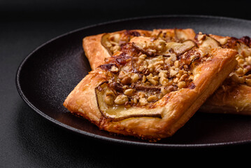 Delicious fresh sweet pie or pizza with pear, brie cheese, honey and nuts