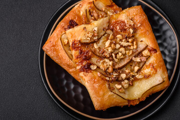 Delicious fresh sweet pie or pizza with pear, brie cheese, honey and nuts