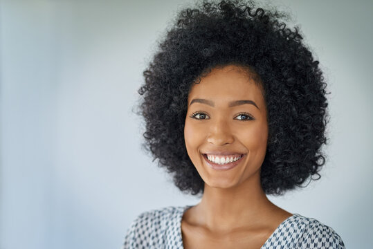 Smile, portrait of happy black woman and in a white background from brazil. Confident or elegant, fashion designer and isolated smiling or excited Brazilian female person in a studio backdrop