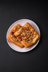Delicious fresh sweet pie or pizza with pear, brie cheese, honey and nuts
