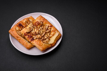 Delicious fresh sweet pie or pizza with pear, brie cheese, honey and nuts