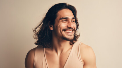 Fototapeta premium A joyful young man gives a toothy smile, lighting up the studio background with his happiness. Generative AI