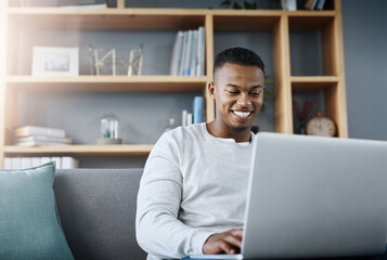 Happy black man with laptop, streaming online and relax in living room, subscription service with...