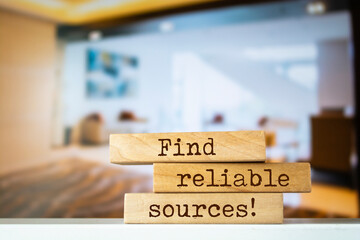 Wooden blocks with words 'Find reliable sources'.