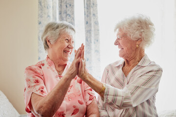 Happy, success and senior women with high five for care, retirement support and happiness. Smile,...