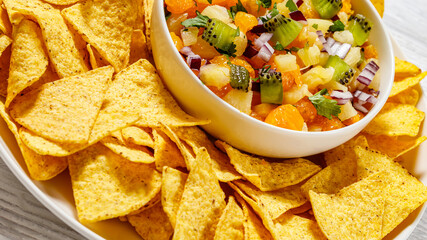 summer fruit salsa with tortilla chips on plate