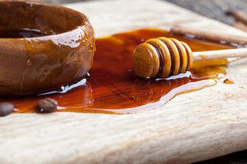 sweet natural bee honey spilled on the table