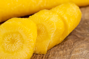 Pieces of sliced peeled carrots are yellow