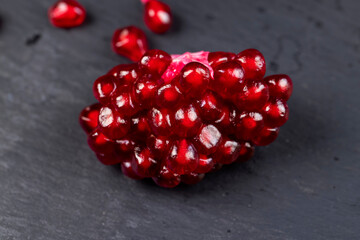 Grains of red ripe pomegranate close up