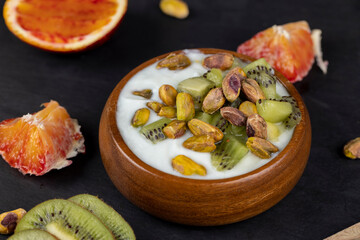 delicious green yogurt with fruit and berry flavor and pistachios