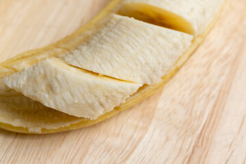 Peeled ripe yellow banana, close up