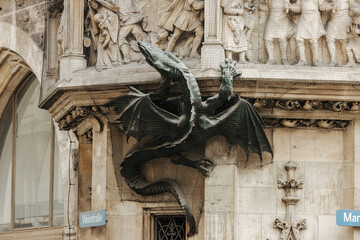 Dragon sculpture climbing the exterior of the famous Munich town hall