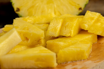 sliced ripe yellow pineapple, a large number of pieces
