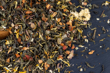 fresh green tea with pieces of fruit and berries