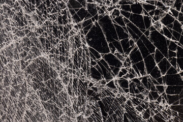 Dirty glass broken into a large number of pieces and parts