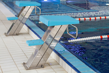 A pedestal for jumping into the water in the pool.