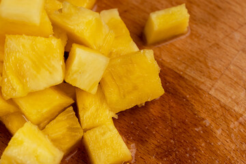 sliced pulp of peeled ripe pineapple , close up