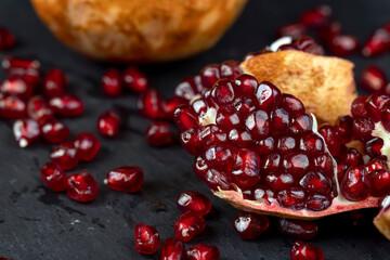 Grains of red ripe pomegranate close up