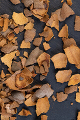 the shell of the peeled tamarind fruit on the table
