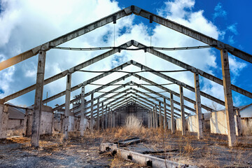 The ruins of an industrial enterprise under the blue sky...