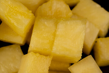 sliced ripe yellow pineapple, a large number of pieces