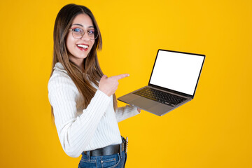 Pointing laptop screen, side view portrait of woman pointing laptop screen. Young businesswoman...