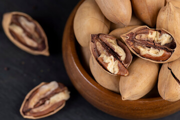 Unpeeled crunchy pecans close up