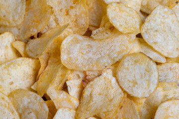 thin potato chips with spices, close up