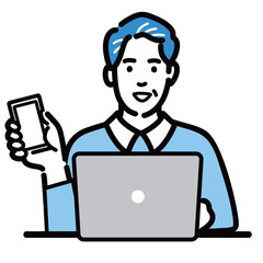 ラップトップの前に座ってスマートフォンを持っている中年男性
