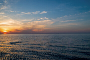 Lake Erie with shoreline at sunset. It is the fourth largest lake of the five Great Lakes in North...