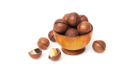 Macadamia nuts in bowl on a white