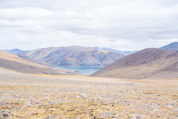 Fototapeta na wymiar Landscape of Desert mountains against clouds sky at the way from Pangong Lake to Tso Moriri, Leh, Ladakh, Jammu and Kashmir, India