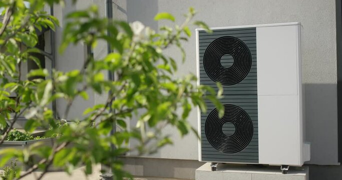 Powerful heat pump for heating and air conditioning of a modern private house. Energy saving technology concept