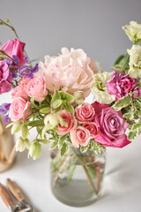 Flower arrangement in a vase for home. Flowers bunch, set for interior. Fresh cut flowers for decoration home. European floral shop. Delivery fresh cut flower.