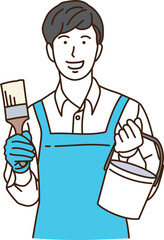 ペンキと刷毛を持つエプロン姿の若い男性
