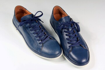 Blue men's street shoes on a white background, for summer time