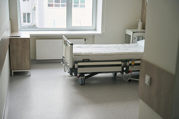 Photo of modern empty hospital room and bed