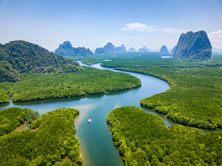 Drone view of the mangrove forests and towering limestone pinnacles and karst landscape of Phangnga...