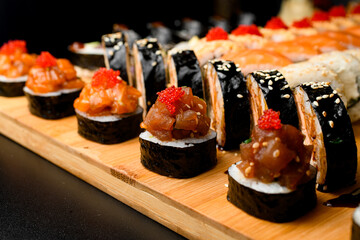 Japanese food. Maki ands rolls with tuna, salmon, cheese, crab and avocado.