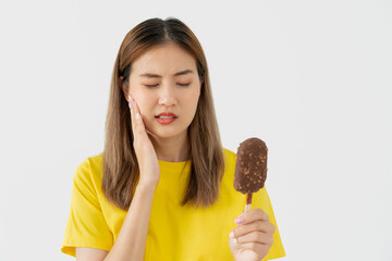 Asian woman feel sensitive teeth after eating ice cream, female suffer tooth, decay problems,...