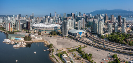 panoramic aerial city view of famous False Creek in Vancouver downtown with Cambie Bridge and BC Place Stadium in front and Vancouver Skyline in the background 